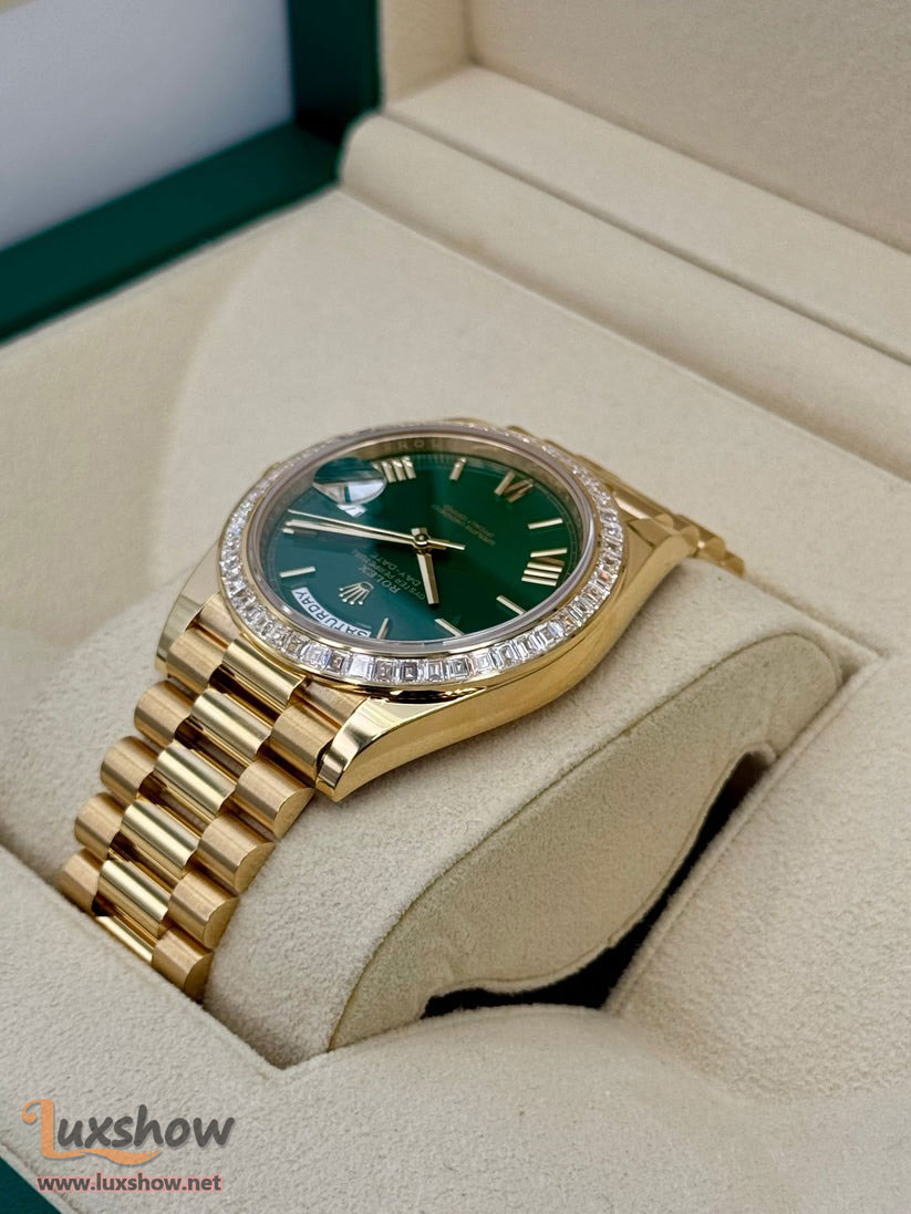 Rolex Day-Date 40mm 228398TBR 18 kt Yellow Gold Presidential Bracelet Factory Baguette Diamond-Set Bezel Green Roman Numeral Dial