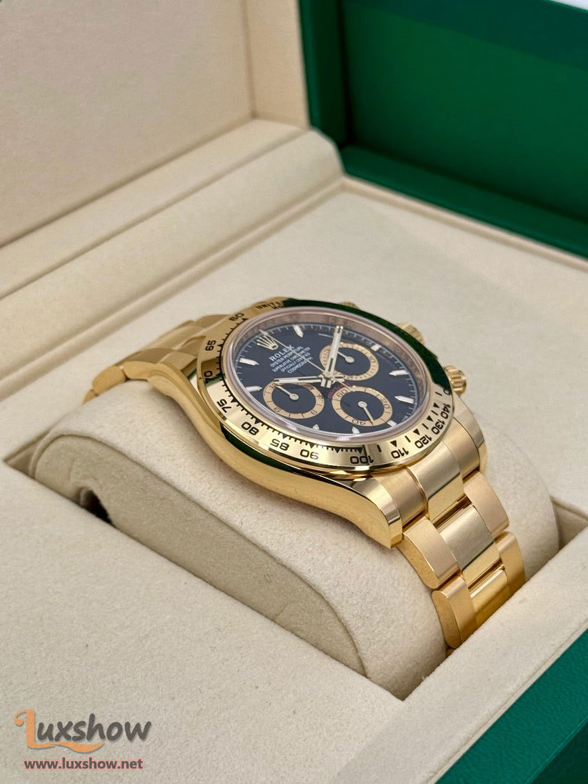 Rolex Cosmograph Daytona 40mm 126508 18kt Yellow Gold Oyster Bracelet a 18kt Yellow Gold Bezel with an Intense Black and Champagne Colour Dial