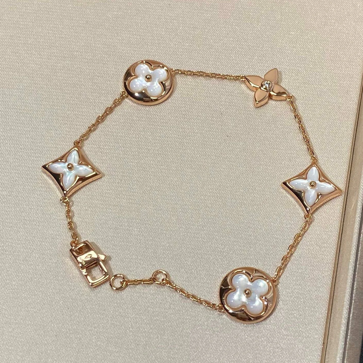 Regalia jewelrySTAR AND SUN 5 MOTIF MOP PINK GOLD BRACELET