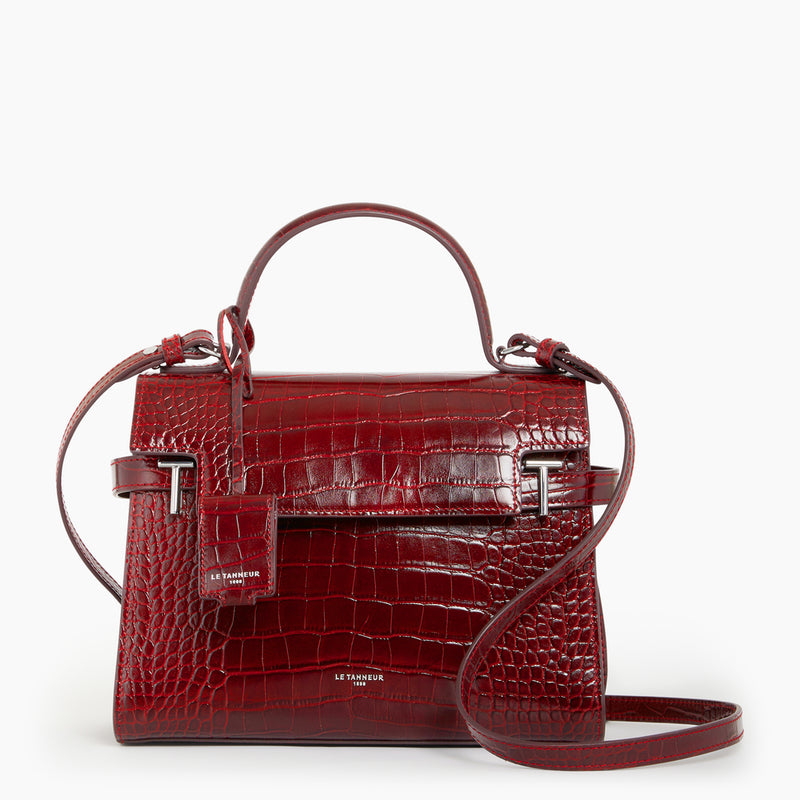Emilie medium-sized handbag with flap closure in crocodile-embossed leather