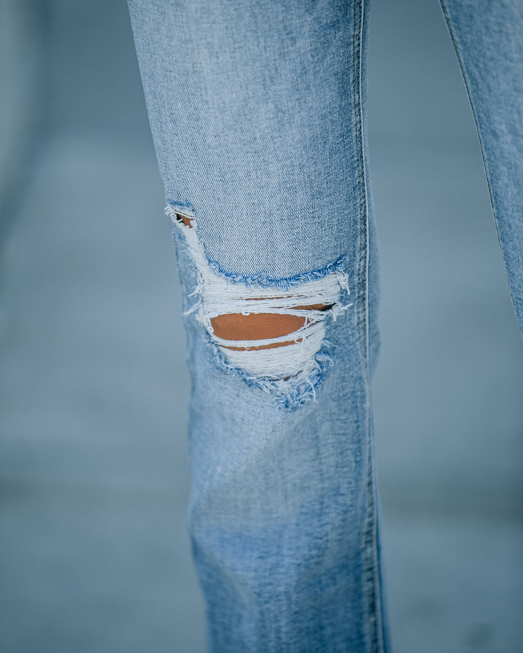 Genie Distressed Mid Rise Bootcut Jeans