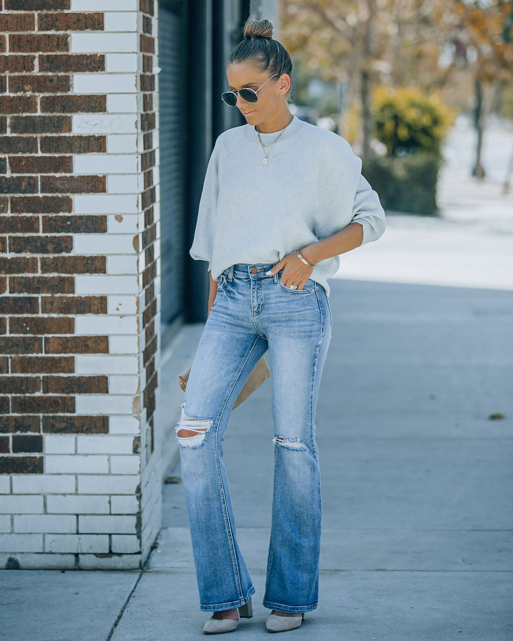 Genie Distressed Mid Rise Bootcut Jeans