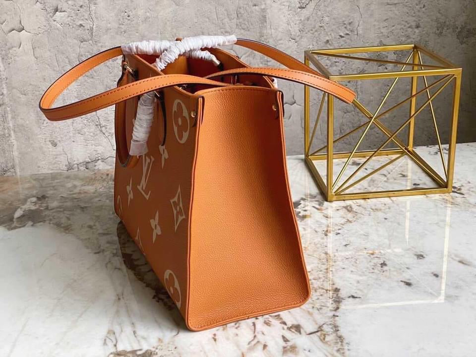 [TOP] L&V On The Go MM Empreinte Bi-Color - Brown & White - LV Louis Vuitton