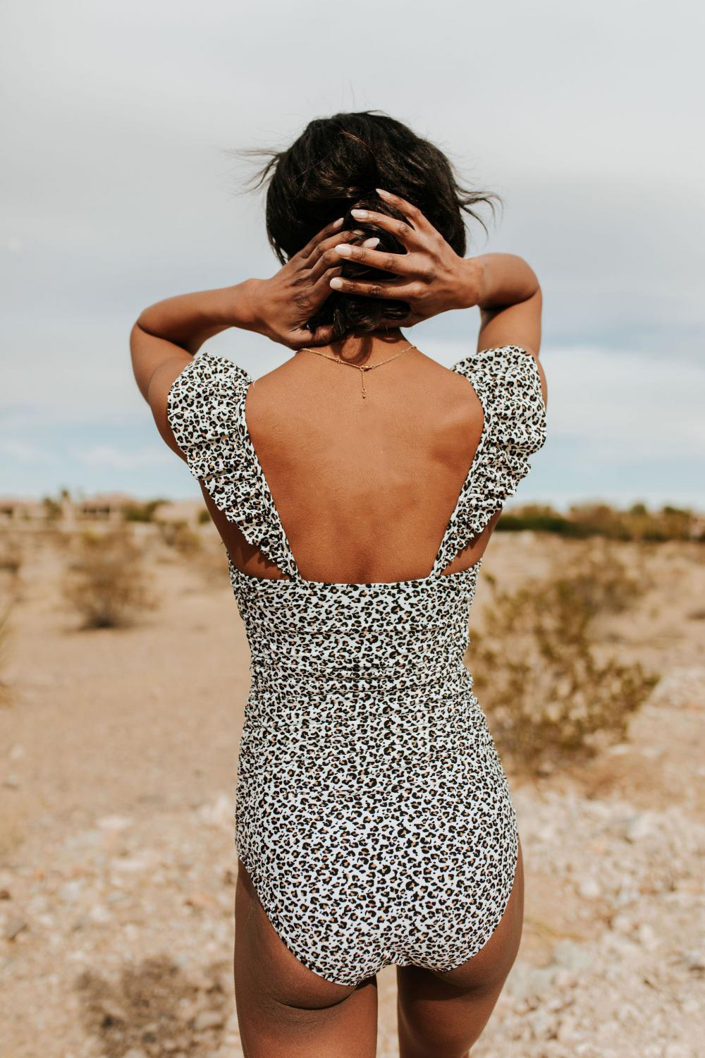 FLUTTER SLEEVE RUCHED ONE PIECE IN SNOW LEOPARD