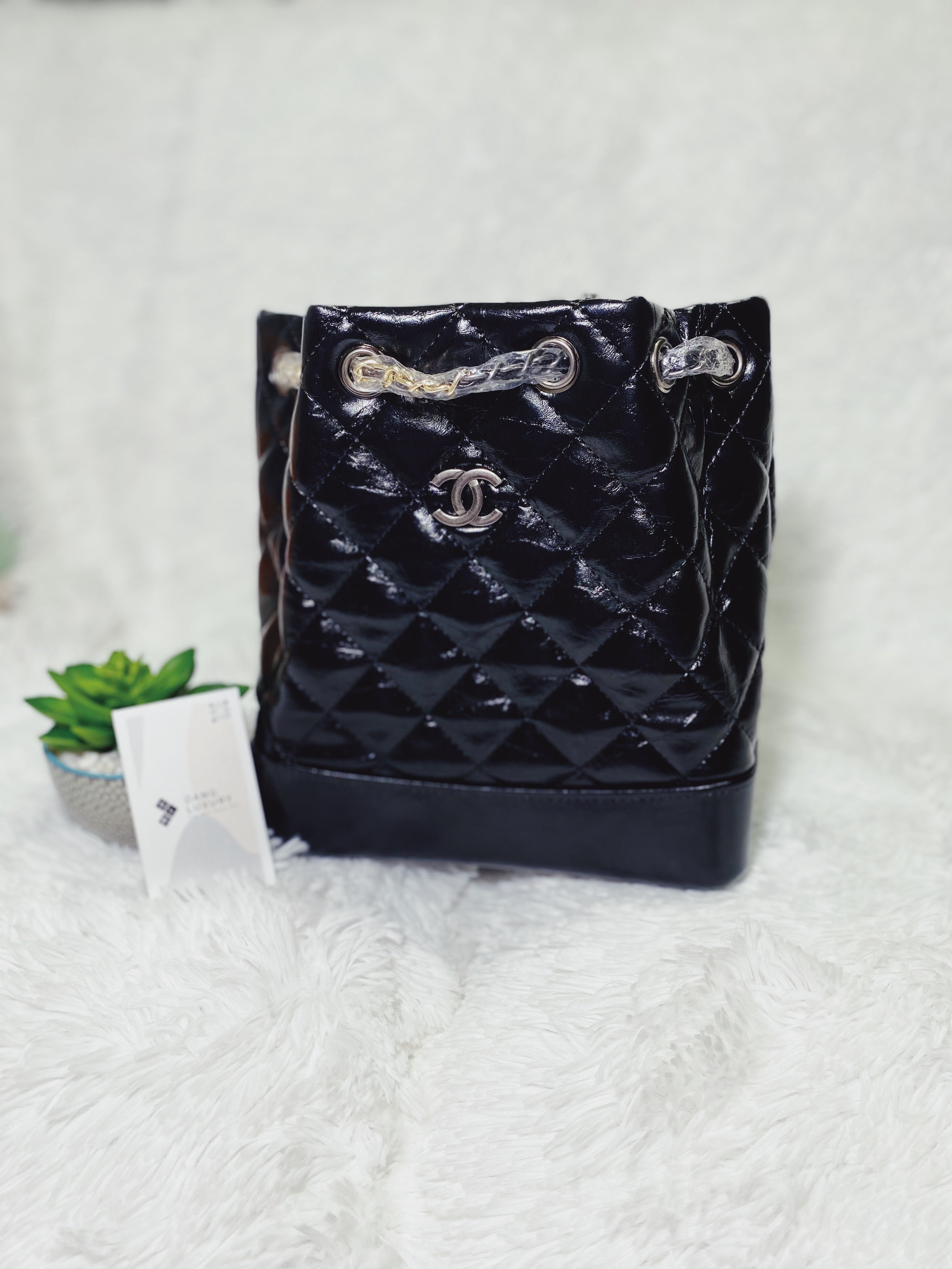 [TOP] CHANEL Quilted Bucket Backpack - BLACK