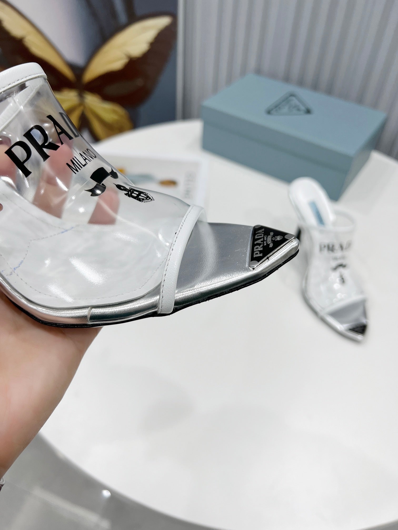 [TOP] PRADA Logo-print Plexiglas High-heel Slides - White