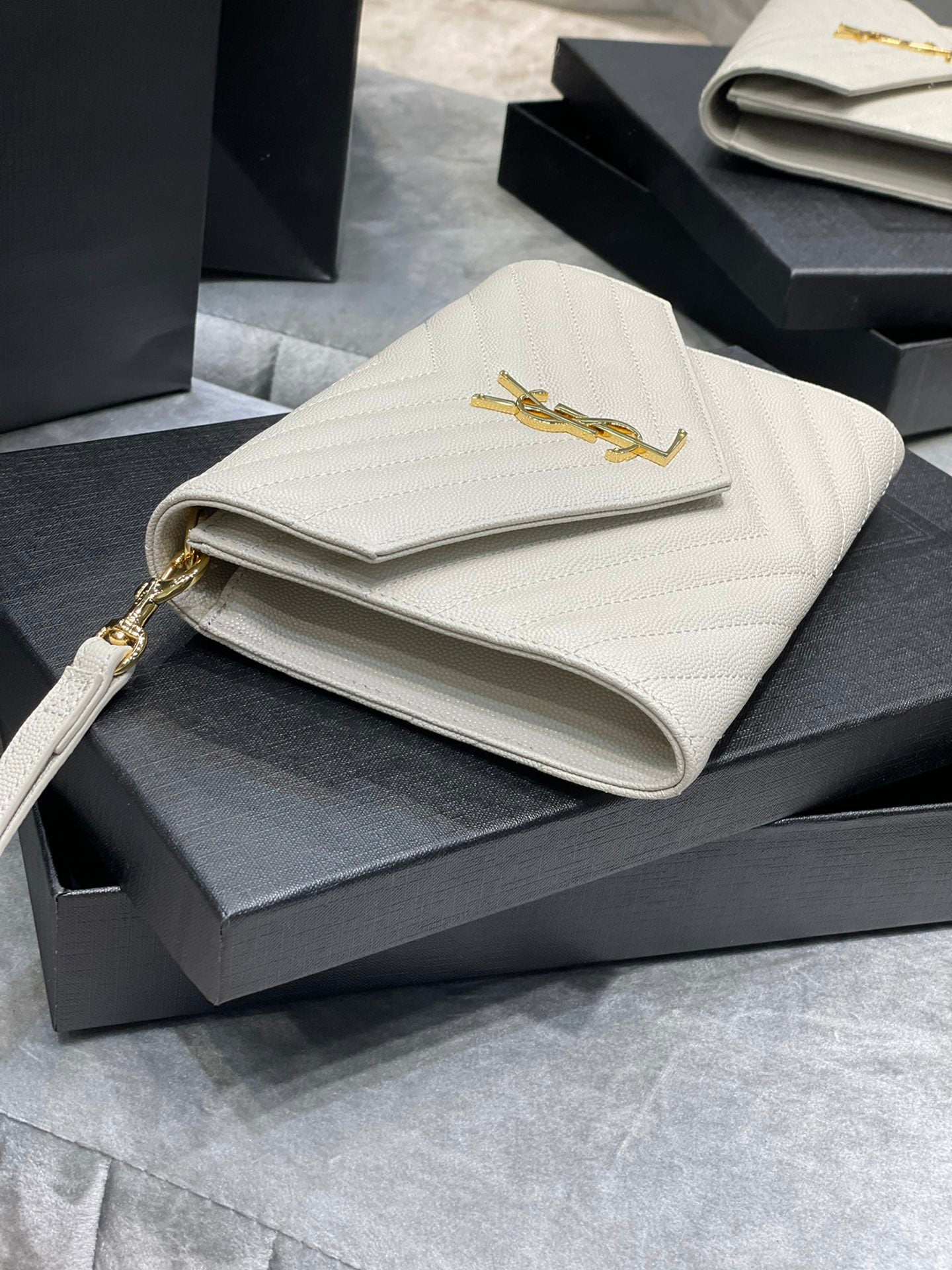[TOP] Yves Saint Laurent YSL Monogram Clutch Embossed Leather - White