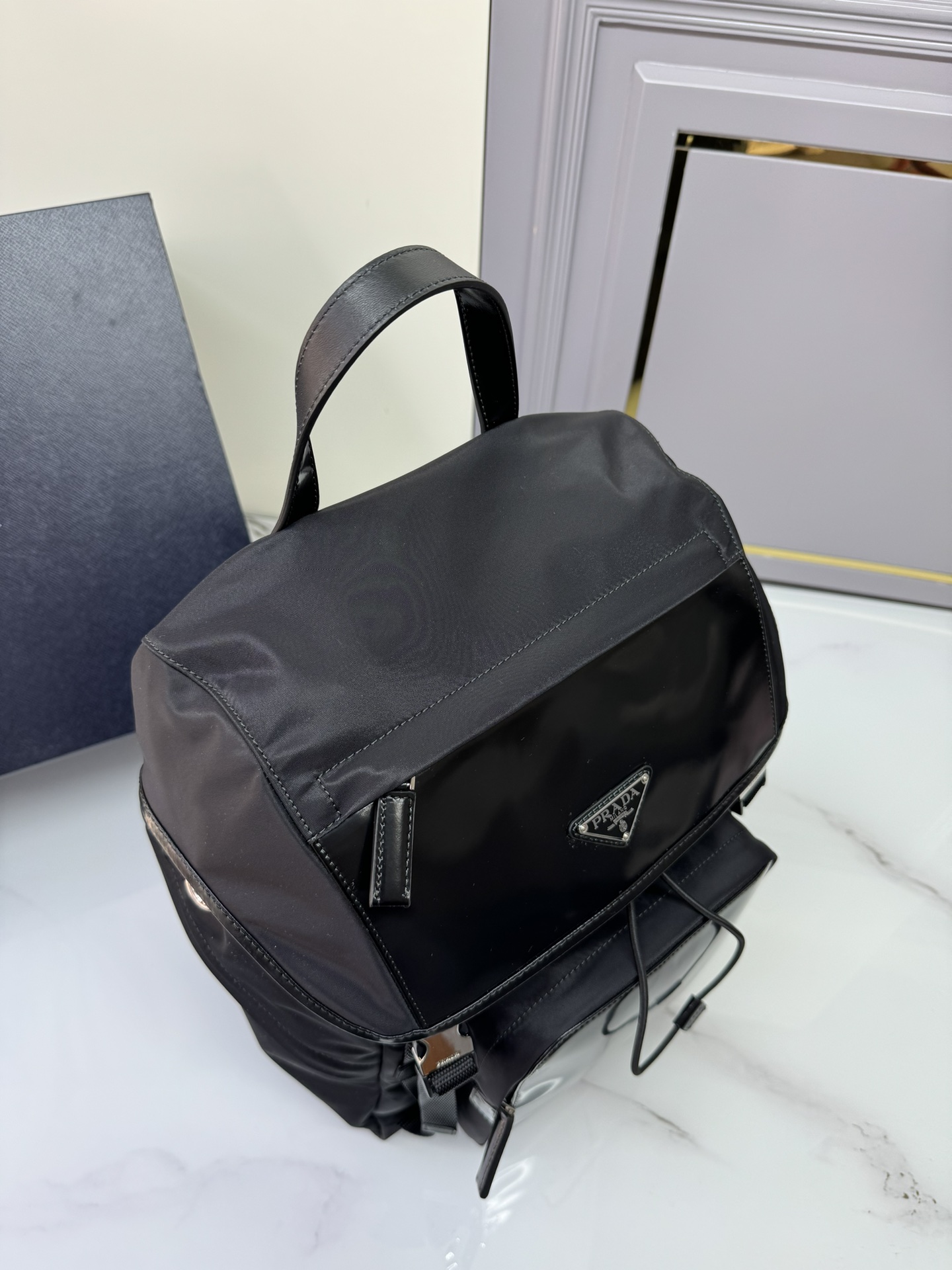 [TOP] PRADA Recycled Nylon Fabric And Glossy Leather Integrated Backpack 27x45x7cm - Black
