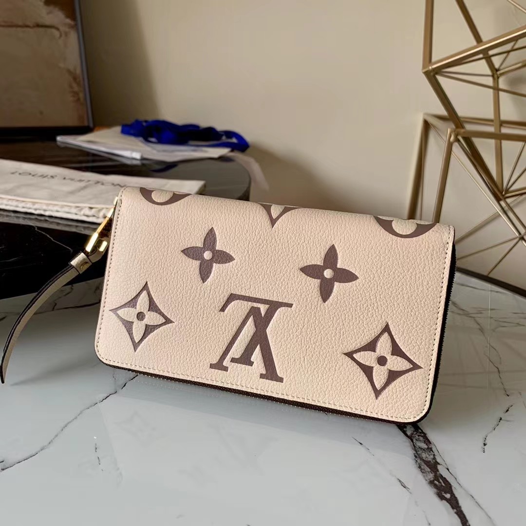 [TOP] Louis Vuitton LV LV Zippy Wallet Empreinte Crafty 2 Tones - Cream