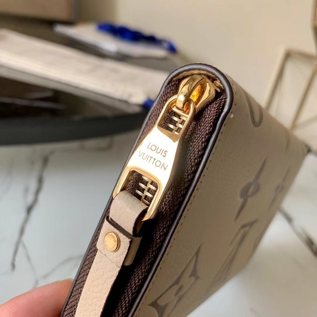 [TOP] Louis Vuitton LV LV Zippy Wallet Empreinte Crafty 2 Tones - Cream