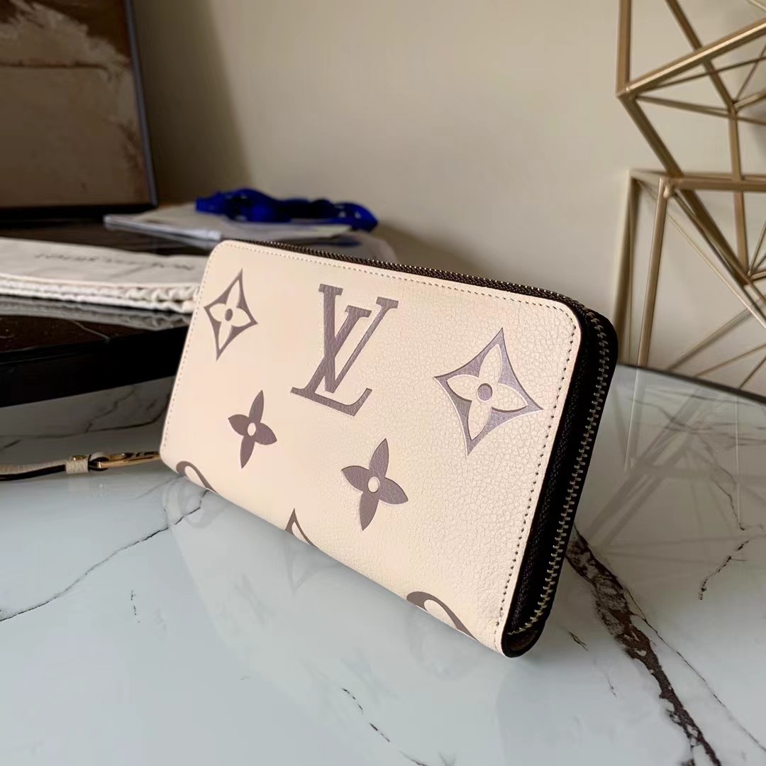 [TOP] Louis Vuitton LV LV Zippy Wallet Empreinte Crafty 2 Tones - Cream