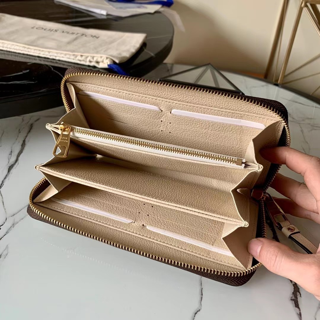 [TOP] Louis Vuitton LV LV Zippy Wallet Empreinte Crafty 2 Tones - Cream