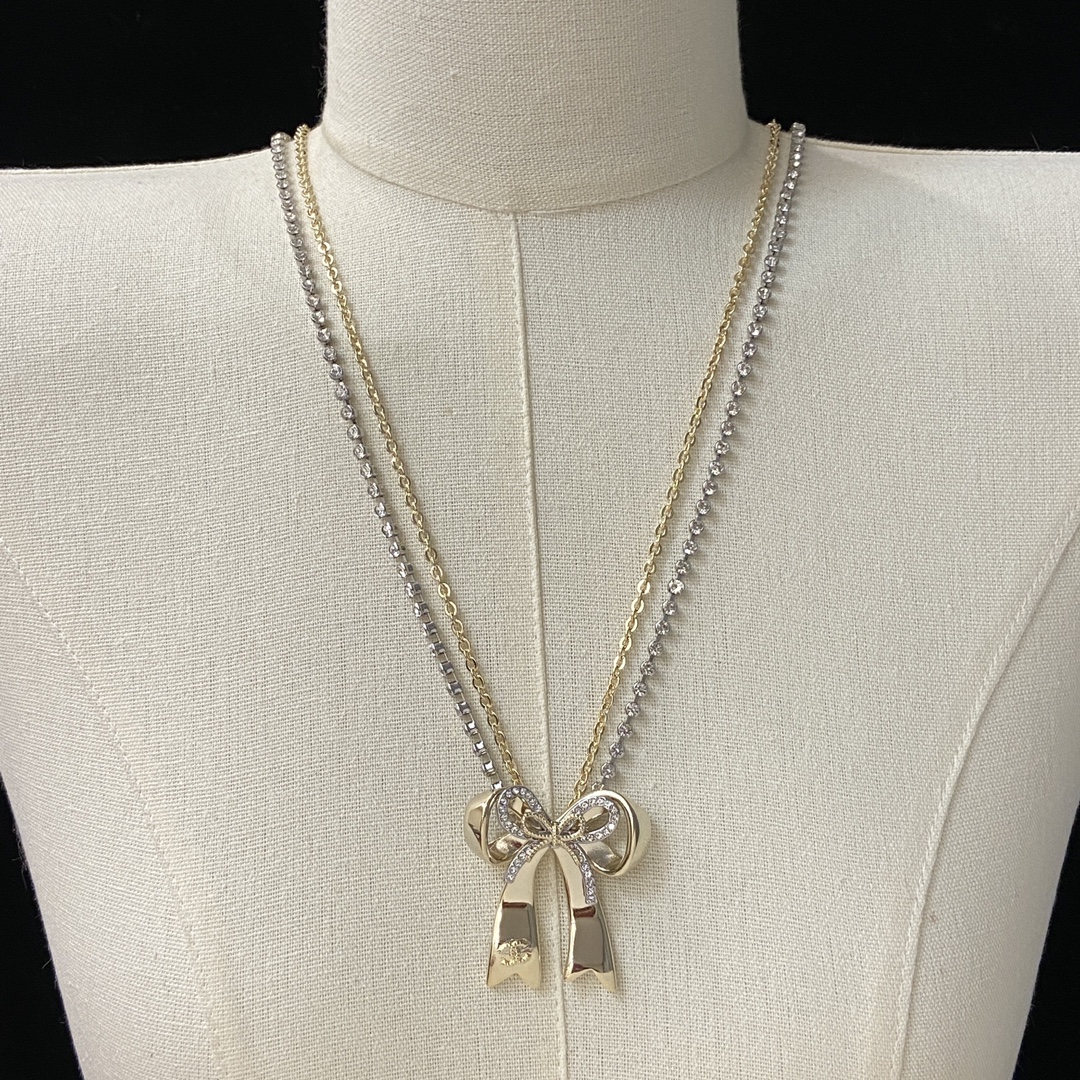 [TOP] CHANEL Long Bow Necklace - Gold and Silver