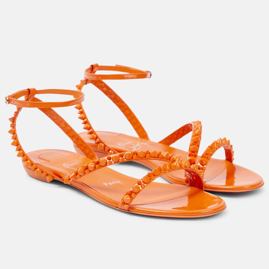 Christian Louboutin Orange flat sandals with diagonal rivets