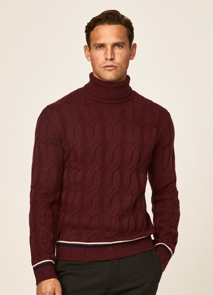 Cable knit roll neck jumper