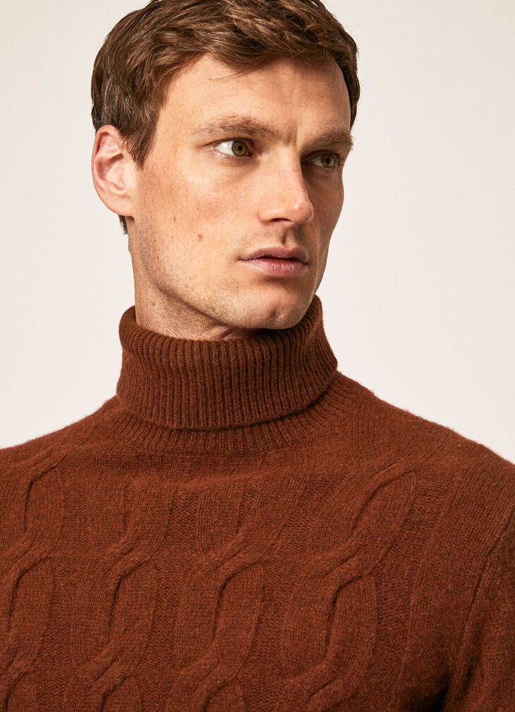 Cable knit roll neck jumper
