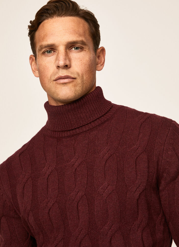 Cable knit roll neck jumper