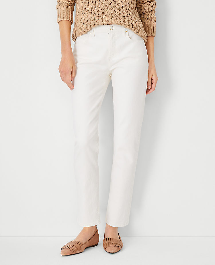 Ann Taylor Sculpting Pocket Mid Rise Tapered Jeans in Ivory