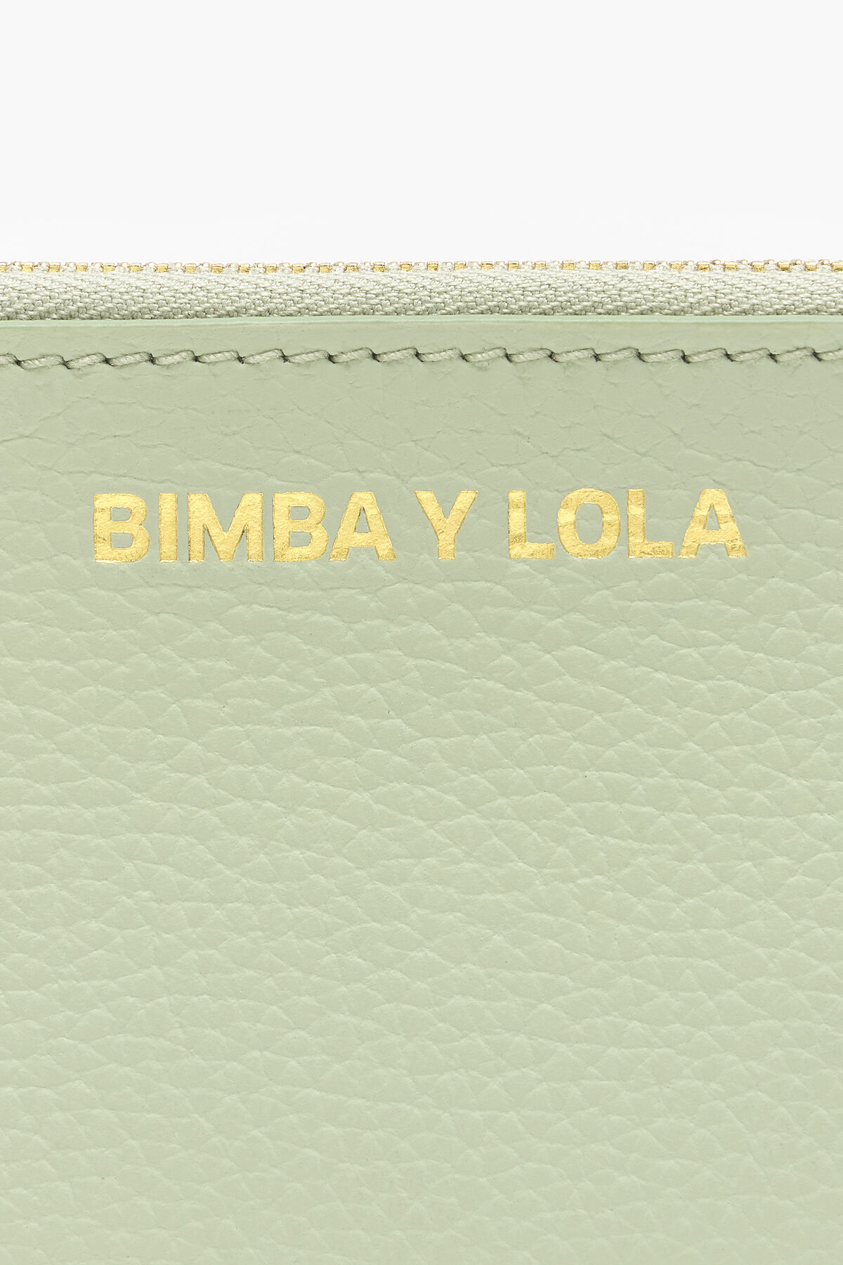 Monedero curvo piel verde pastel