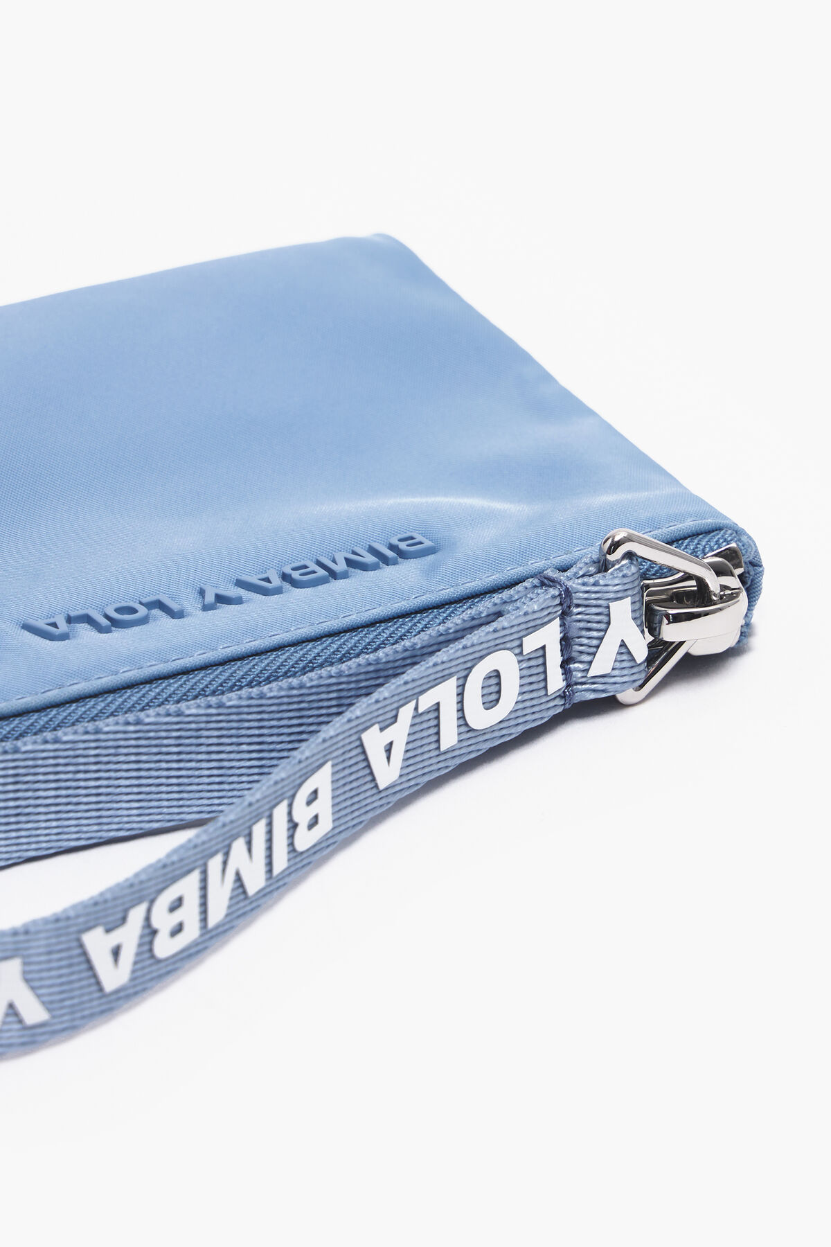 Monedero curvo nylon azul pastel