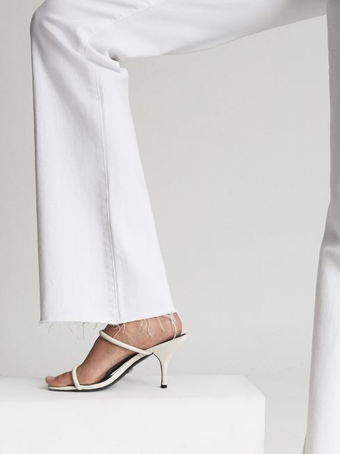 Laurel High Rise Raw Hem Flared Jeans