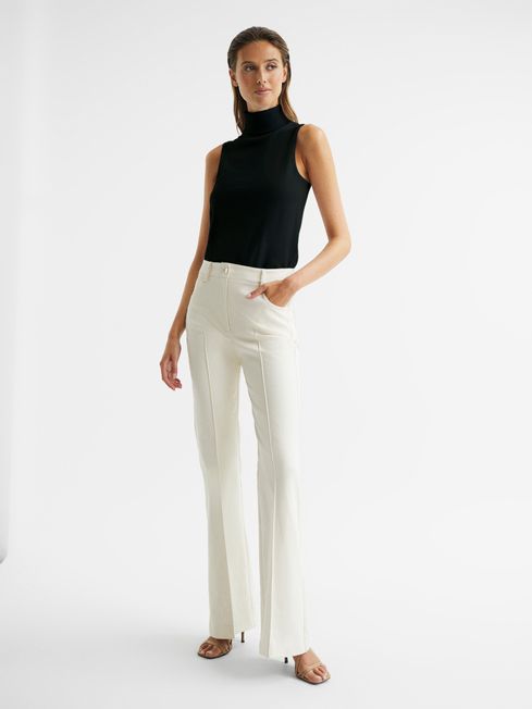 Edna Sleeveless Roll Neck Jumper