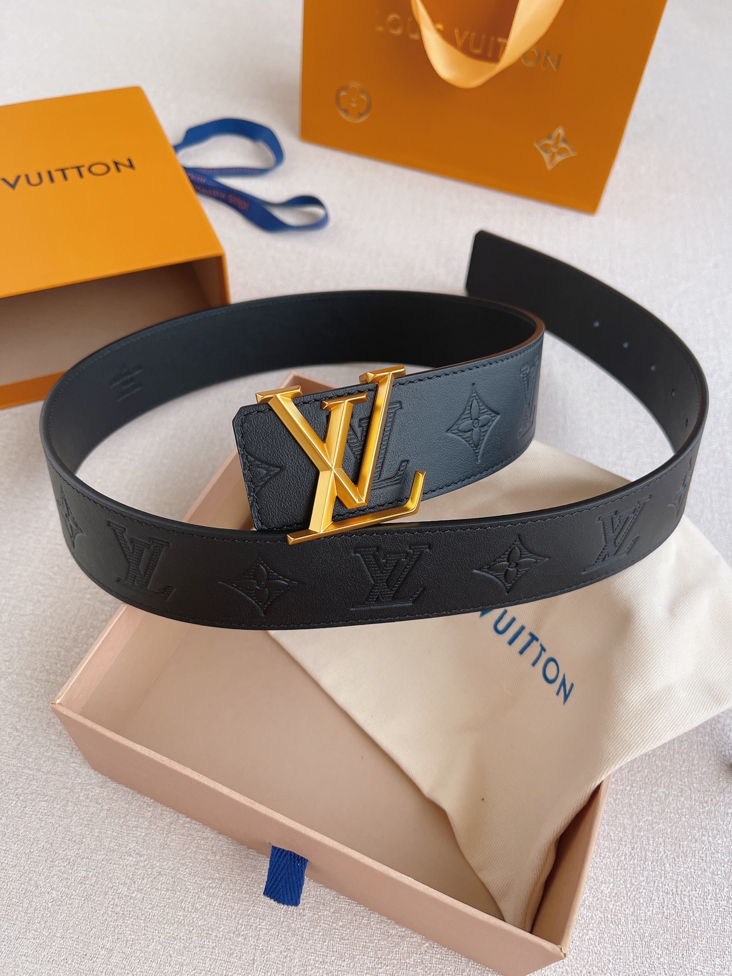 LOUIS VUITTO natural calfskin with Louis Vuitton signature design elements
