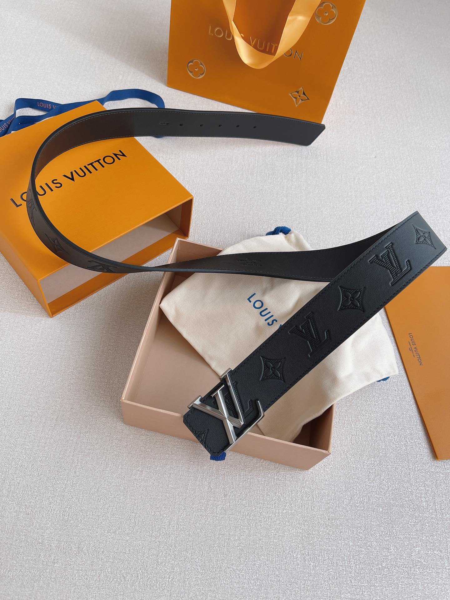 LOUIS VUITTO natural calfskin with Louis Vuitton signature design elements
