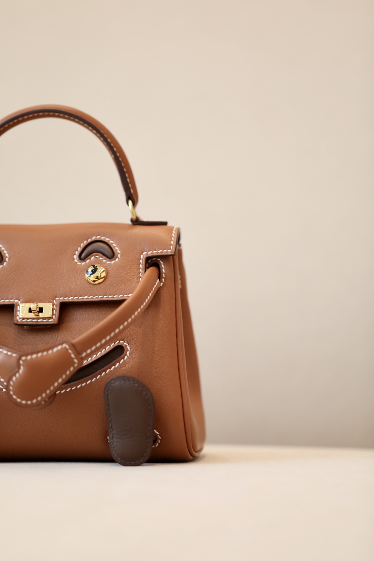 Kelly dolly material using swift cowhide gold brown spell coffee