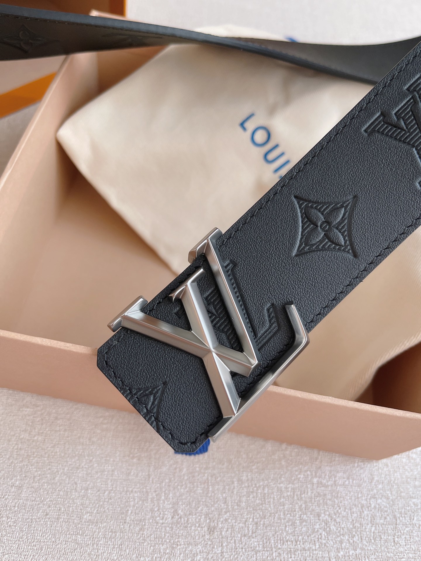 LOUIS VUITTO natural calfskin with Louis Vuitton signature design elements