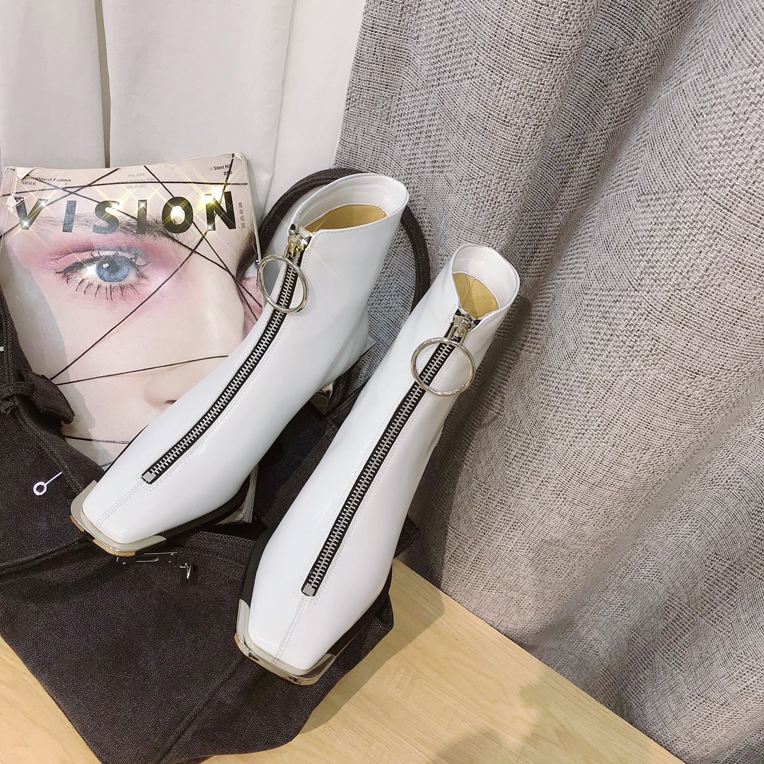 Lost in echo boots with large round buckle