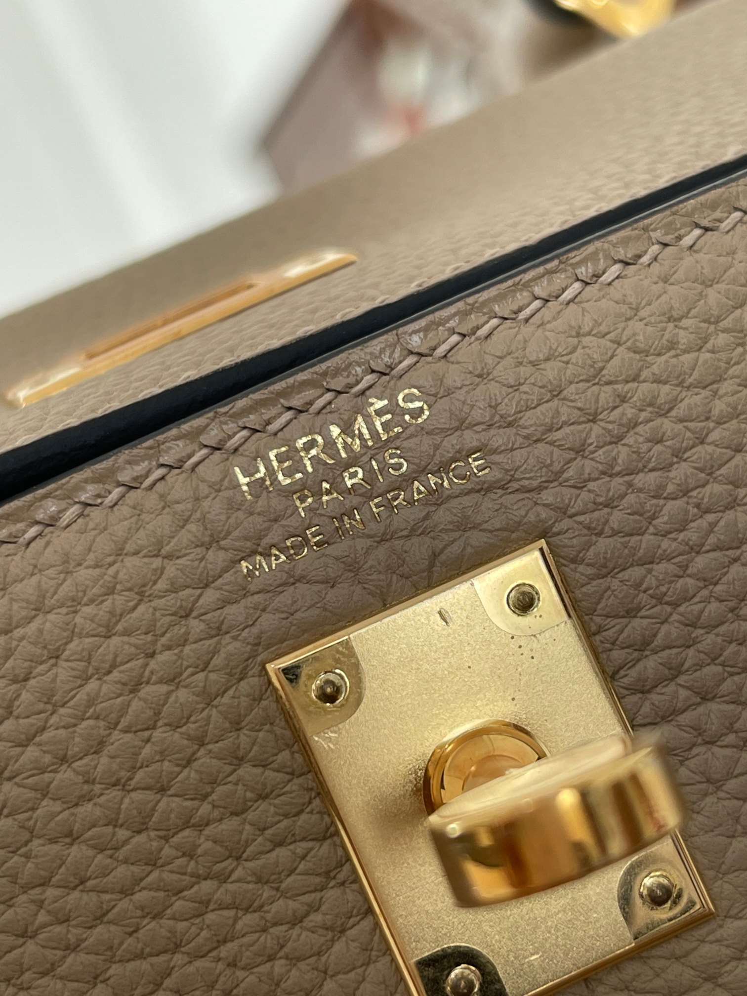 Kelly25 trench coat gray togo leather gold buckle