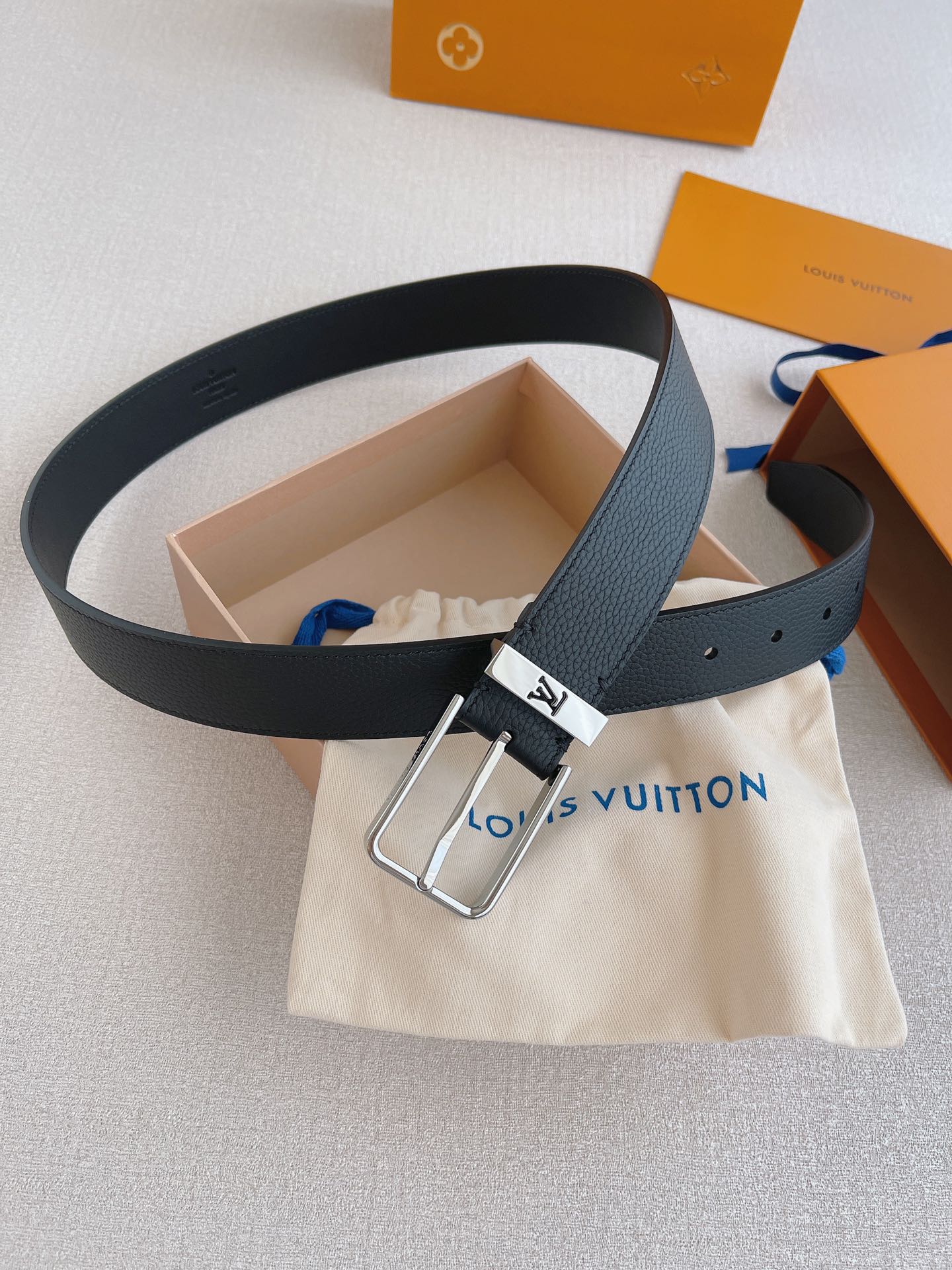 LOUIS VUITTO natural calfskin with Louis Vuitton signature design elements