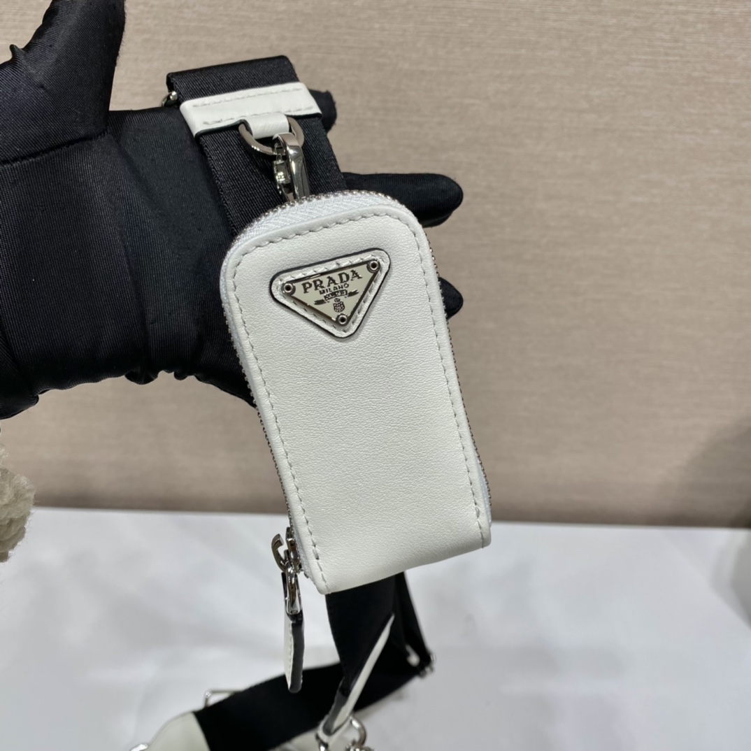 𝐏𝐑𝐀𝐃𝐀 Triangle Crossbody Bag 1BH190