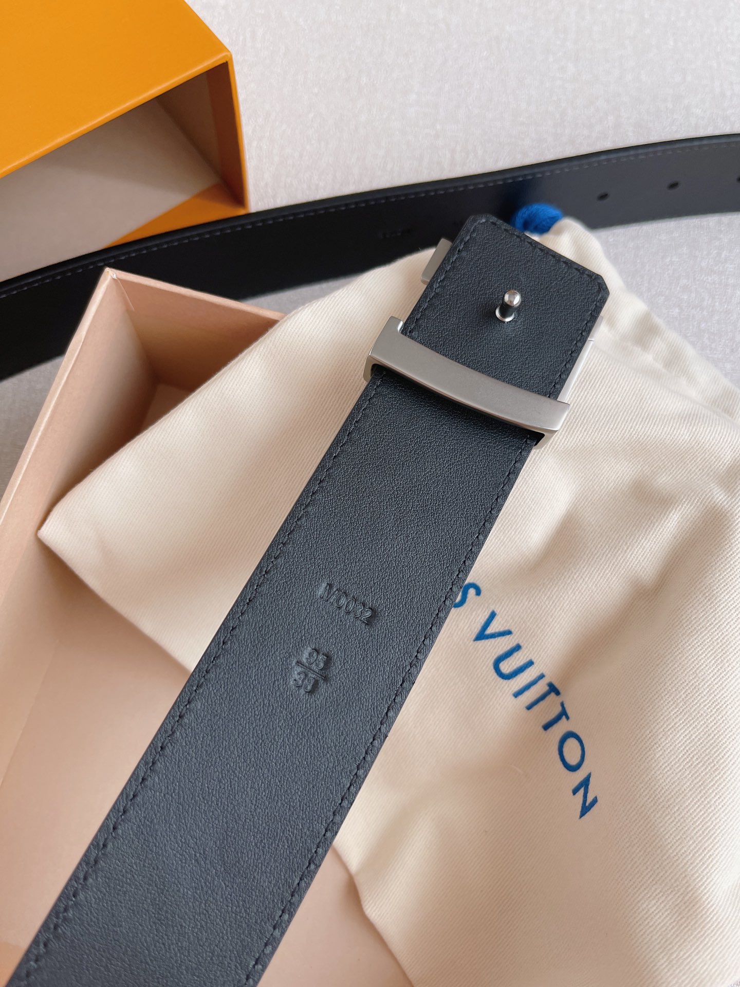 LOUIS VUITTO natural calfskin with Louis Vuitton signature design elements