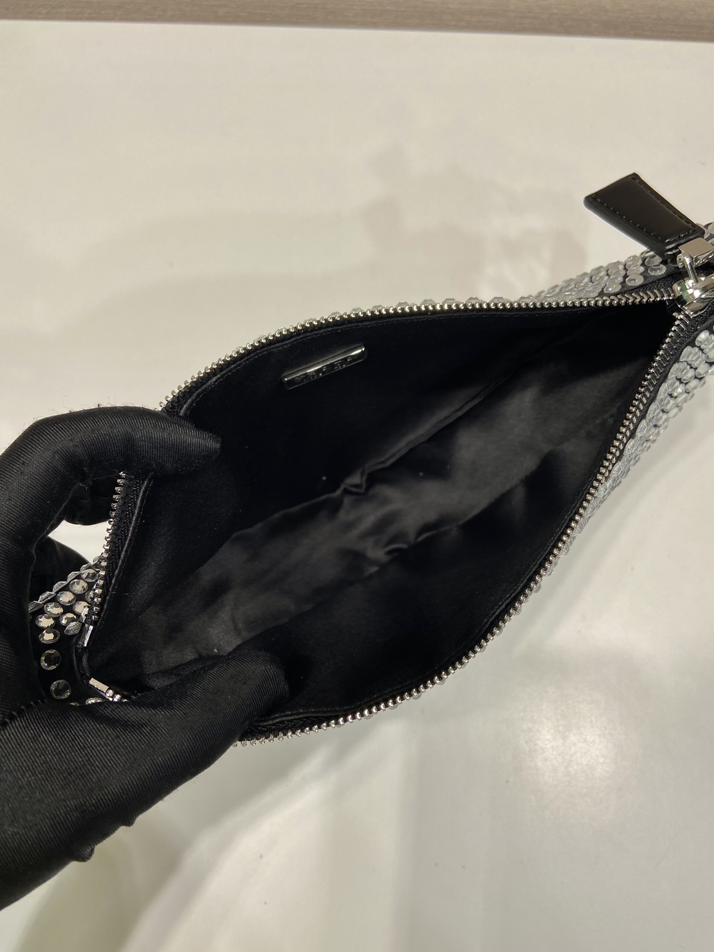 𝐏𝐑𝐀𝐃𝐀 Triangle bag with glitter diamonds 1BH190
