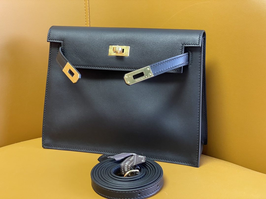Kelly Danes black swift leather gold buckle