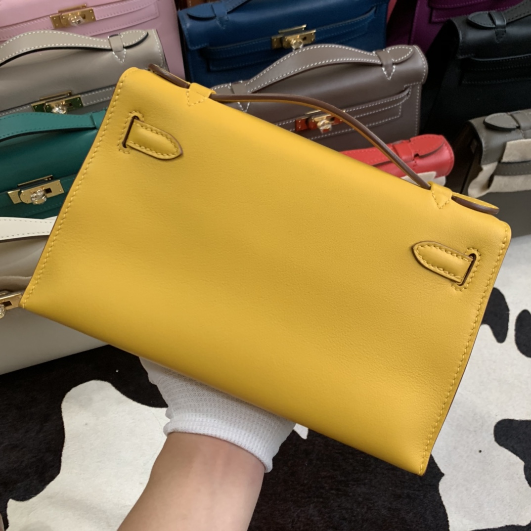 Minikelly pochette a generation of original imported swift leather amber yellow