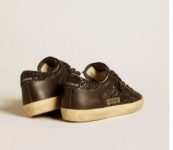 Golden Goose GGDB Women Sneaker Shoes Super-Star in black glitter with black suede star and leather inserts