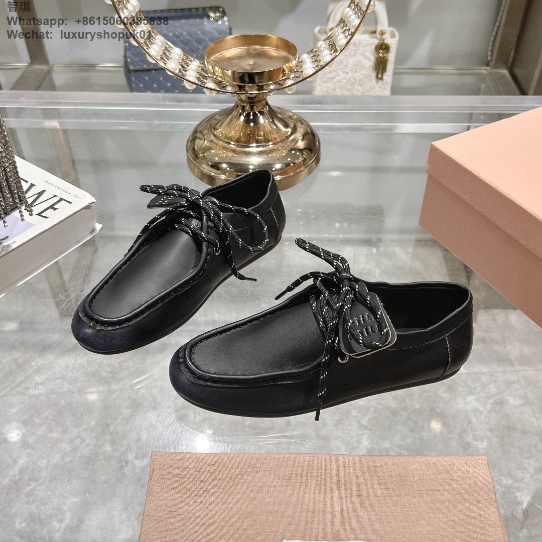 Miu Miu logo-embossed suede loafers tie-detailing round toe Women flat shoes