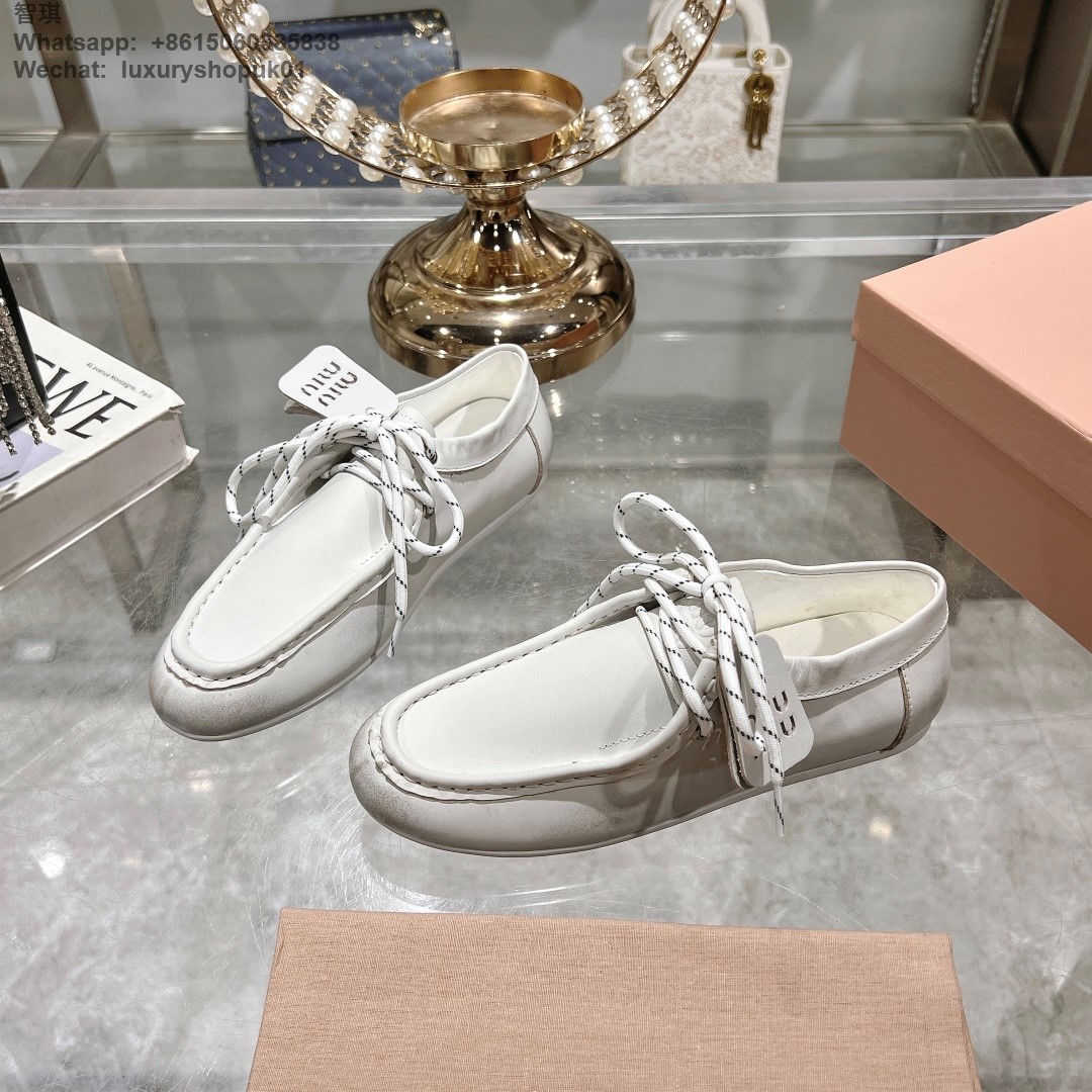 Miu Miu logo-embossed suede loafers tie-detailing round toe Women flat shoes