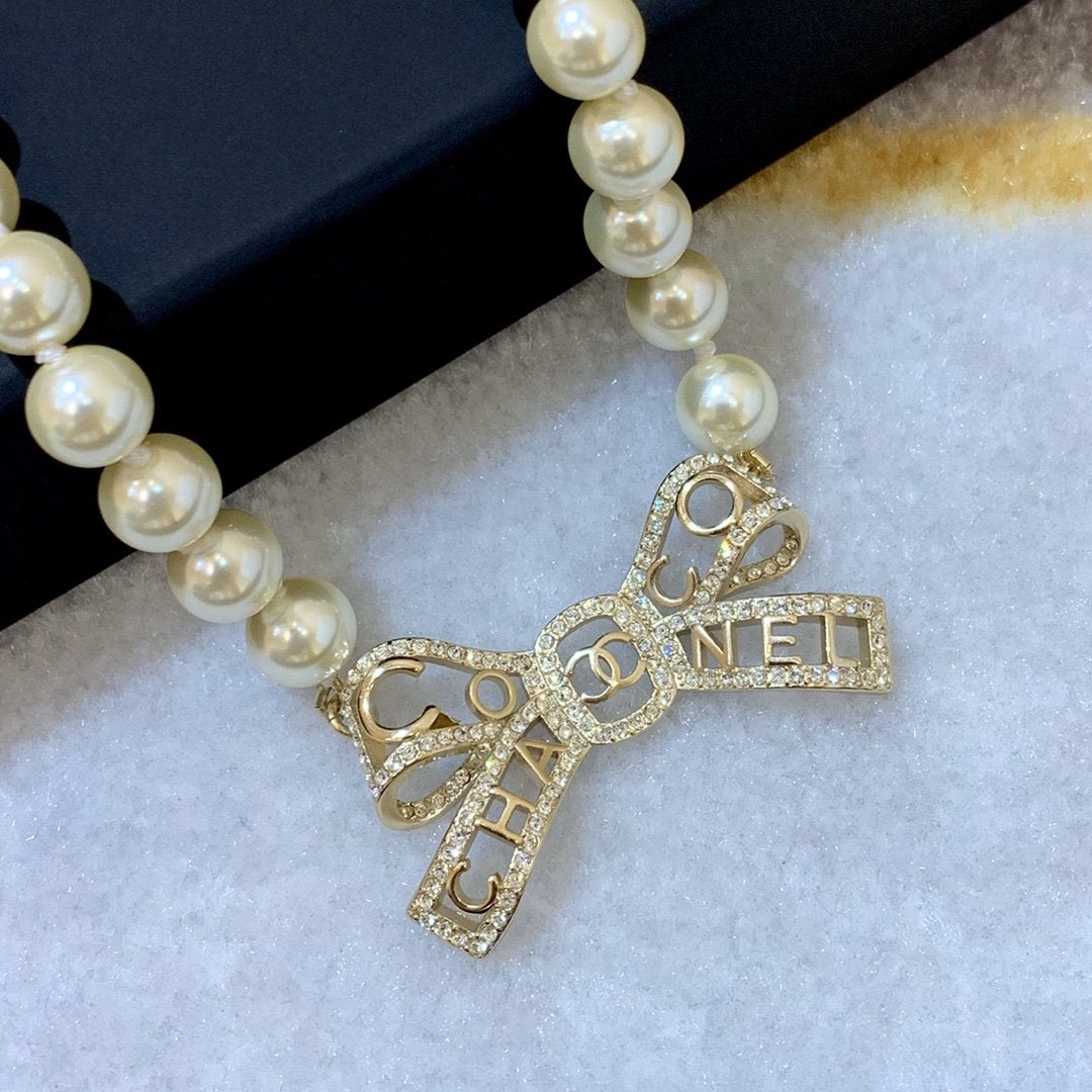CHANEL New Letter Hollow Bow Pendant Necklace