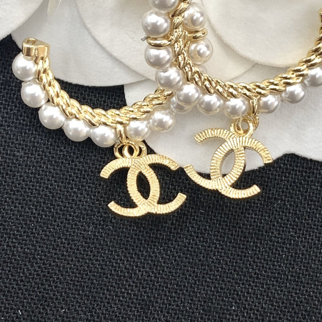 CHANEL Elegant Pearl Double C Pendant Earrings