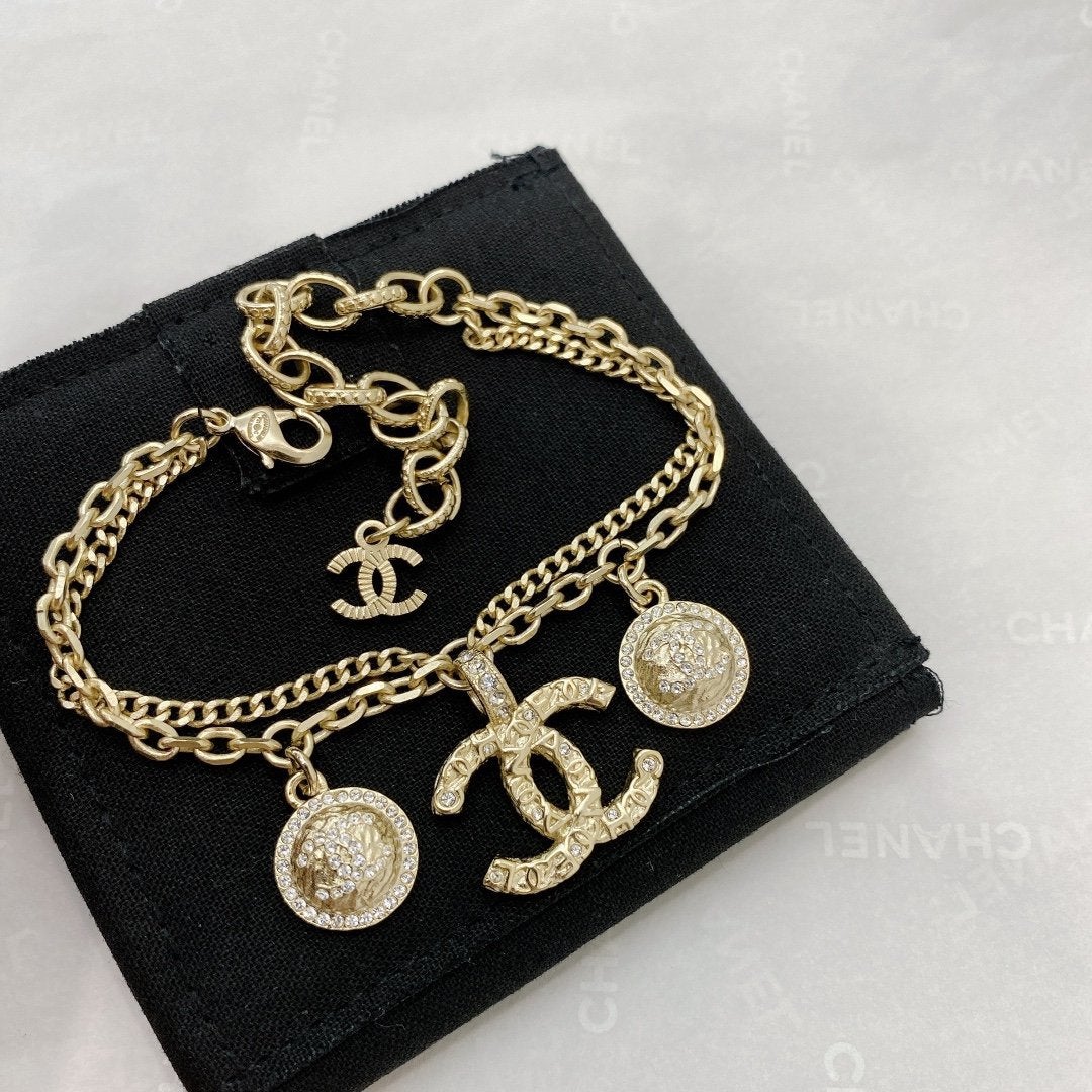 CHANEL Letter Embossed Rhinestone Bracelet
