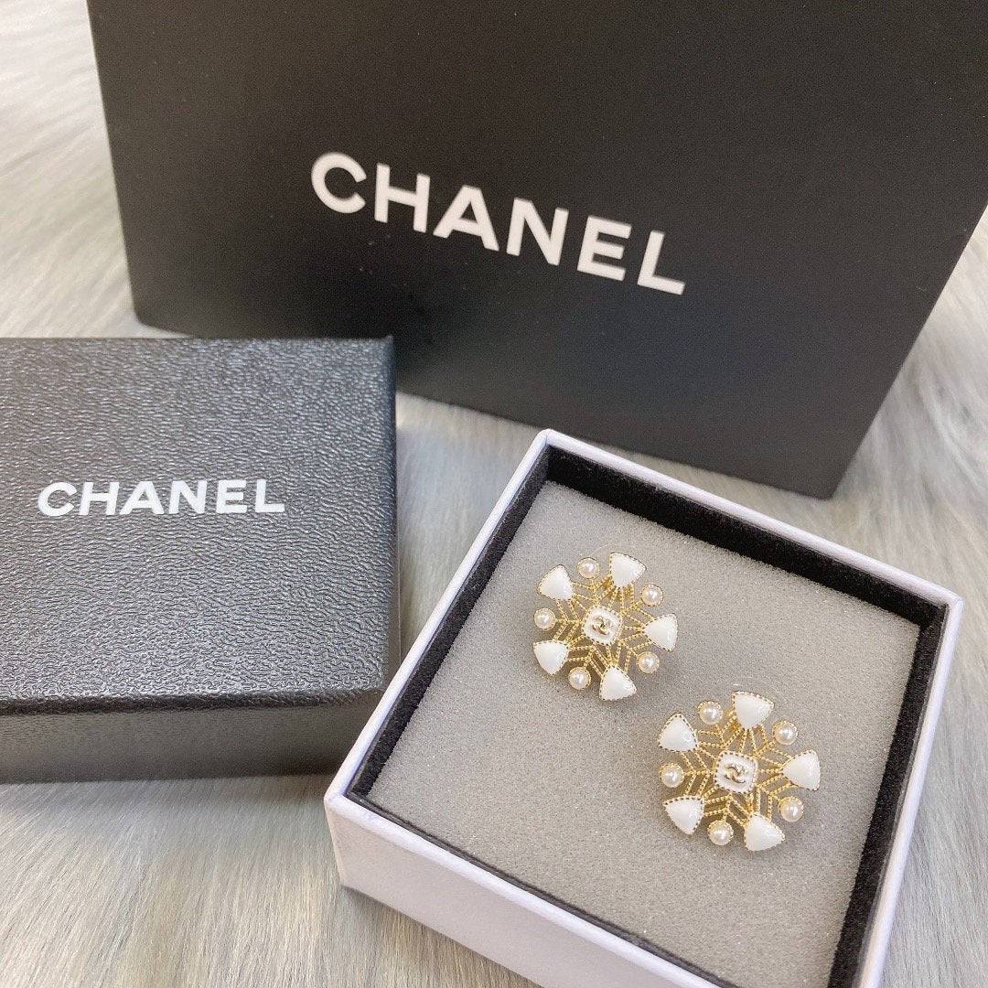 CHANEL White snowflake hollow earrings