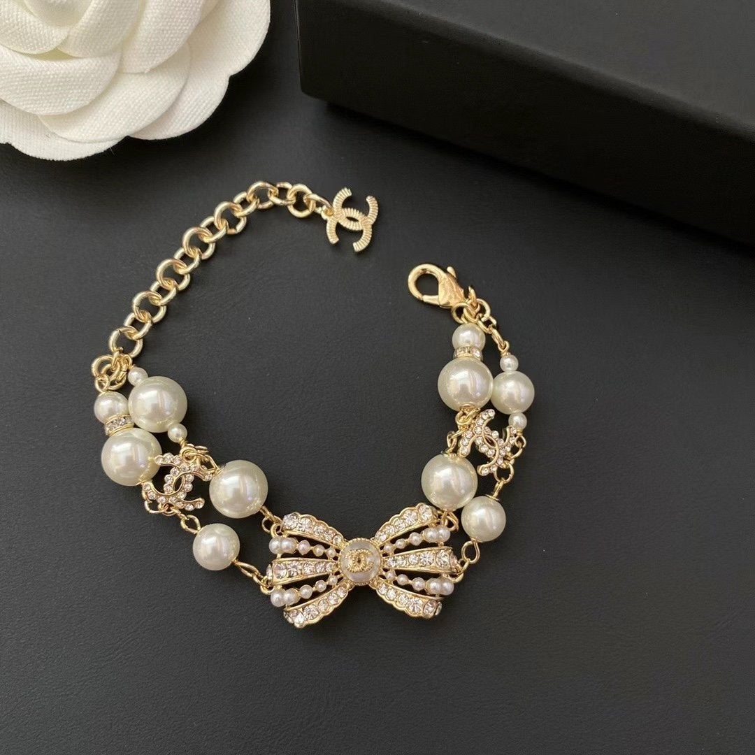 CHANEL Luxury Pearl Rhinestone Bow Bracelet