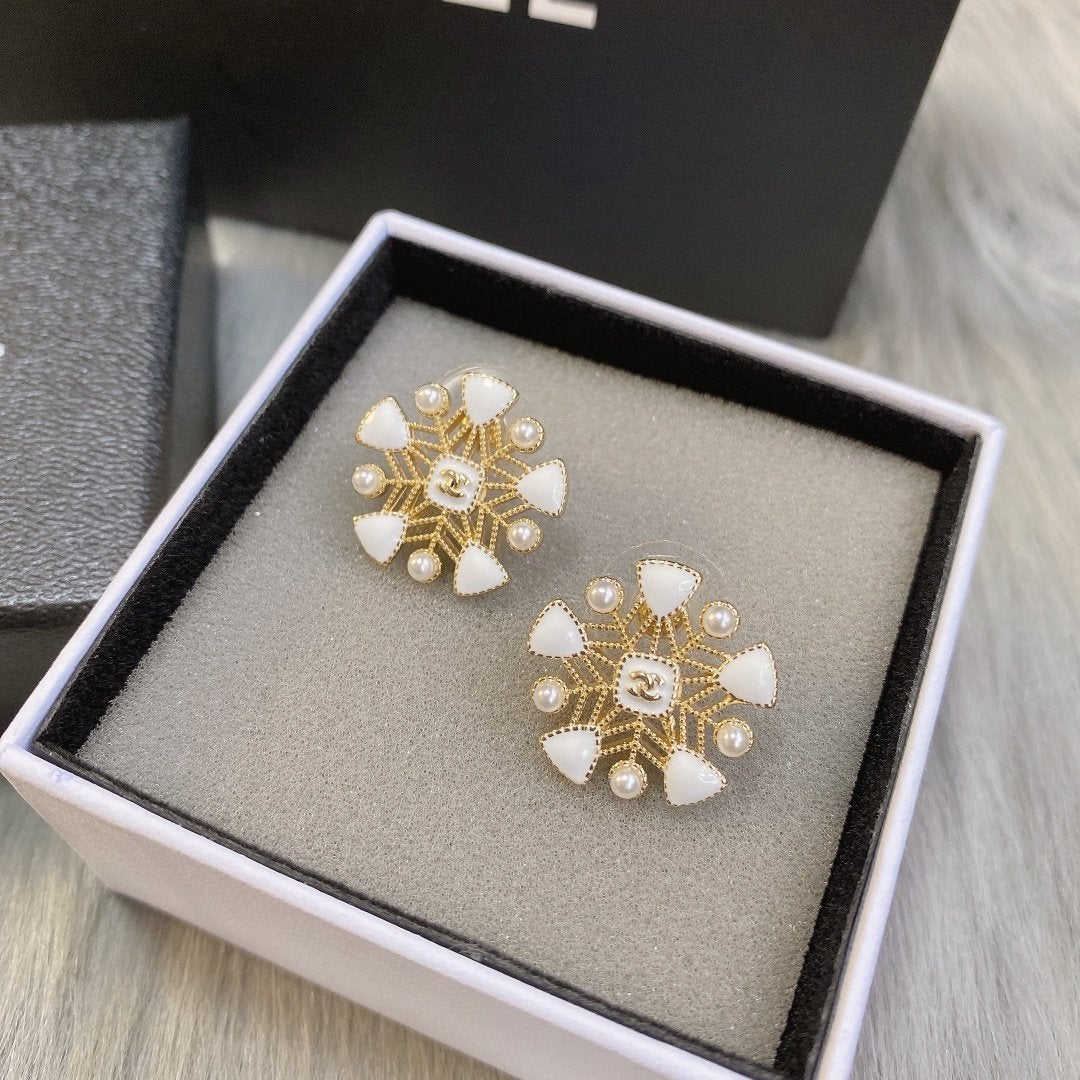 CHANEL White snowflake hollow earrings