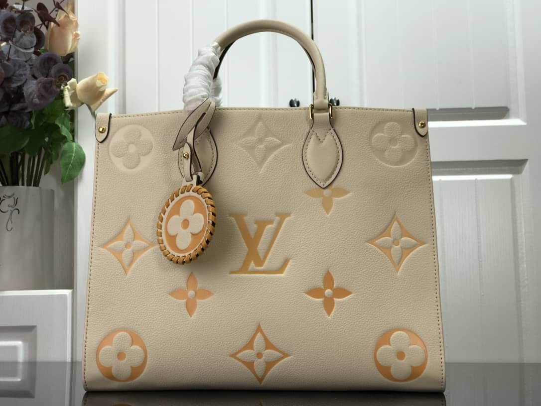 Louis Vuitton On the Go MM Monogram Empreinte Two-way Tote Replica Apricot M45717