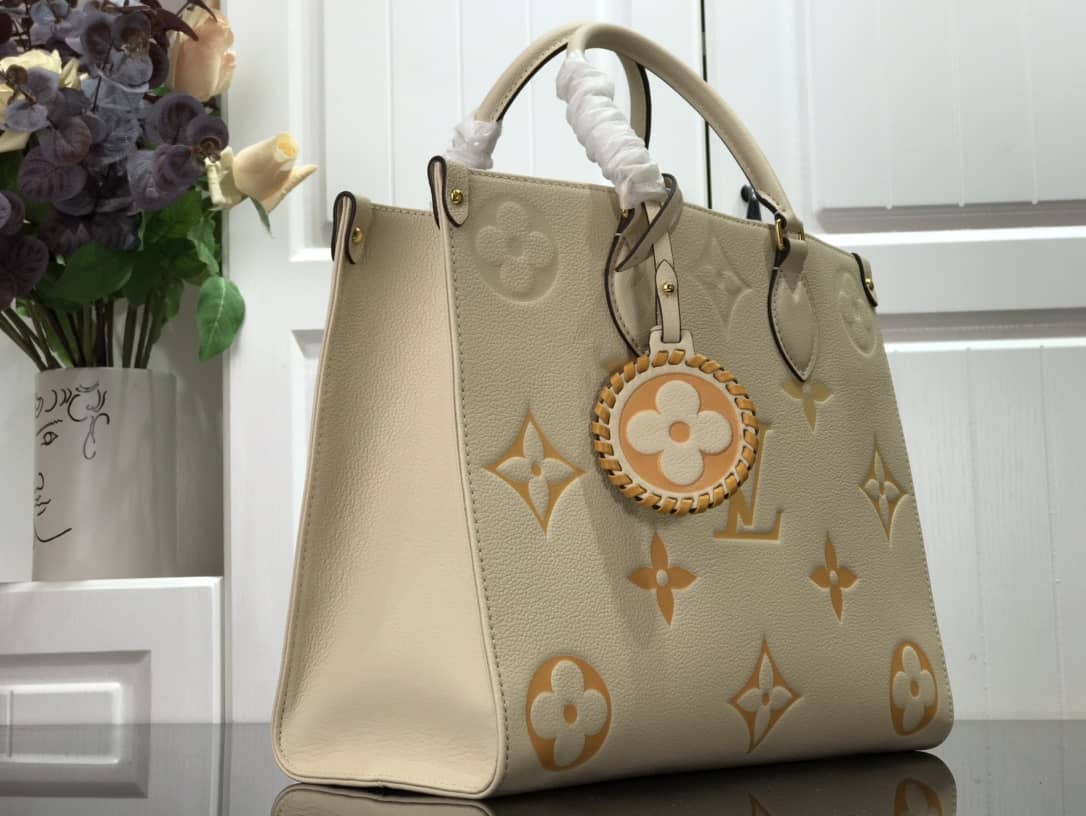 Louis Vuitton On the Go MM Monogram Empreinte Two-way Tote Replica Apricot M45717
