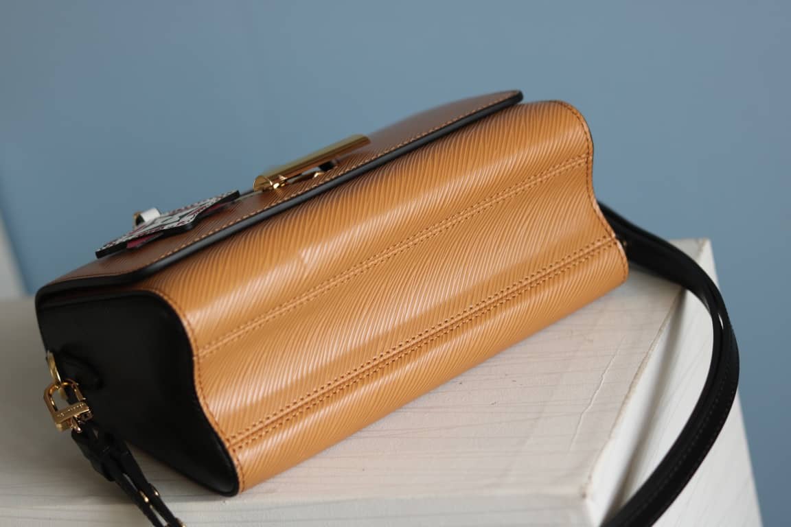 Louis Vuitton Textured Epi Leather Twist Series Bag Brown